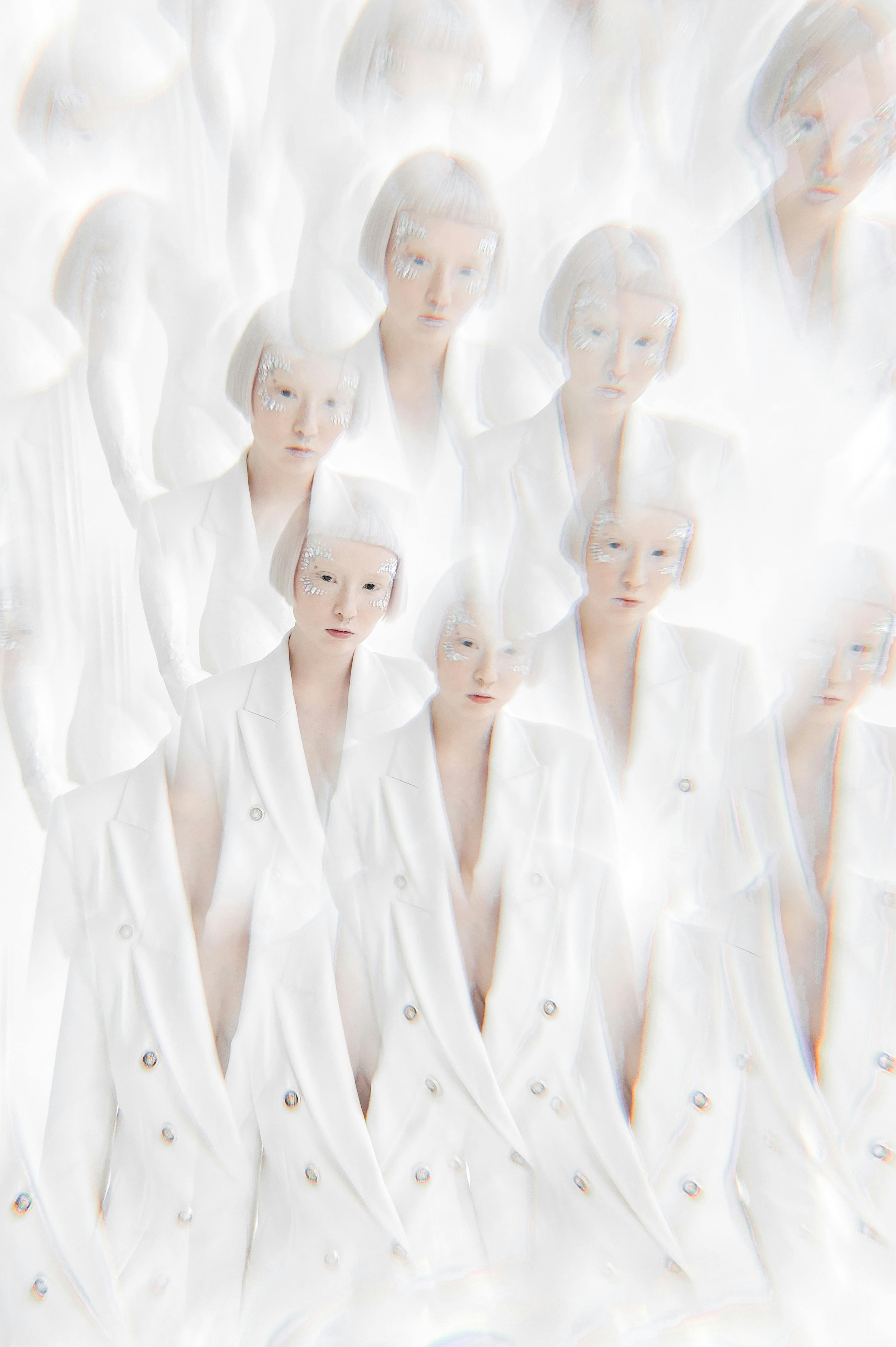 Creative surreal portrait of a woman in white, featuring a multiplied effect for artistic impact.